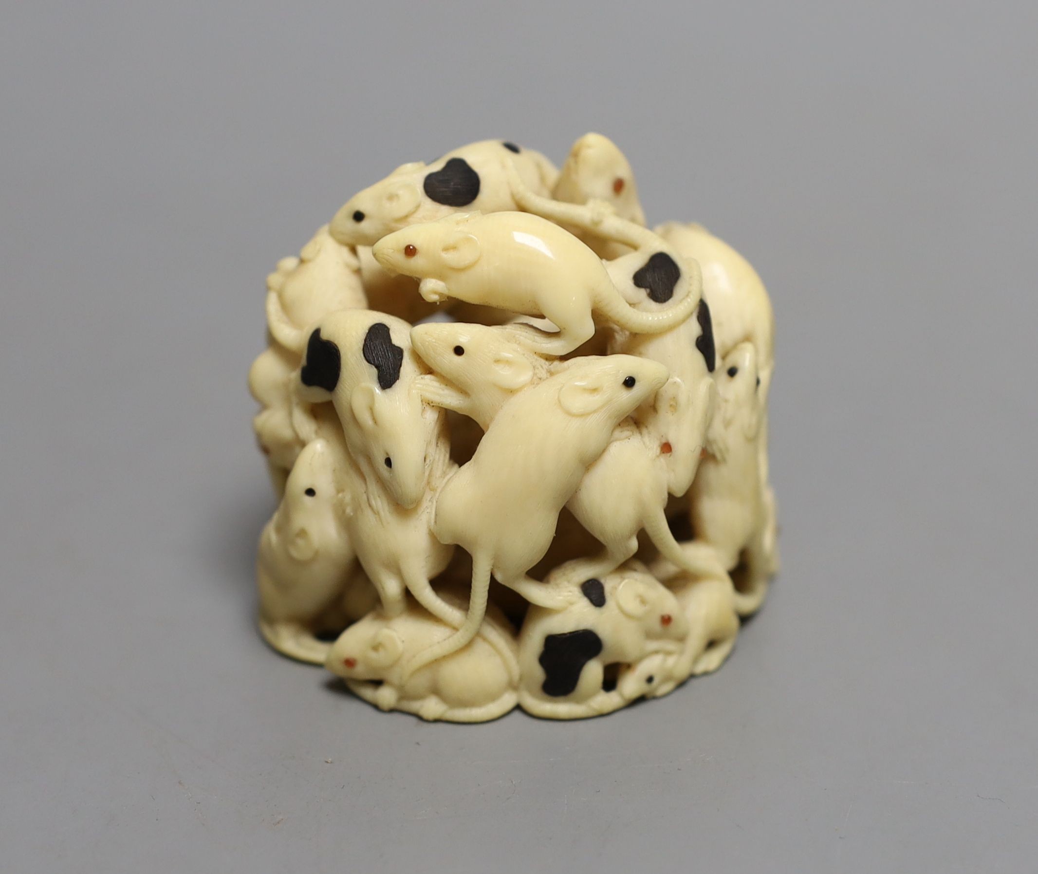 A fine Japanese carved ivory Okimono of a “mischief “ of rats, Meiji period, six character inscription, 5cms high.